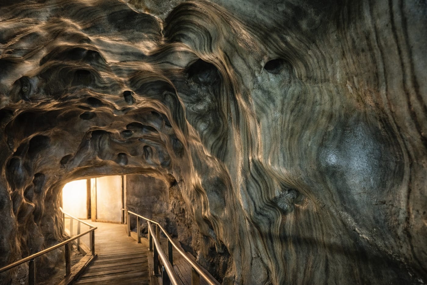 Interior walkway and lit underground chamber