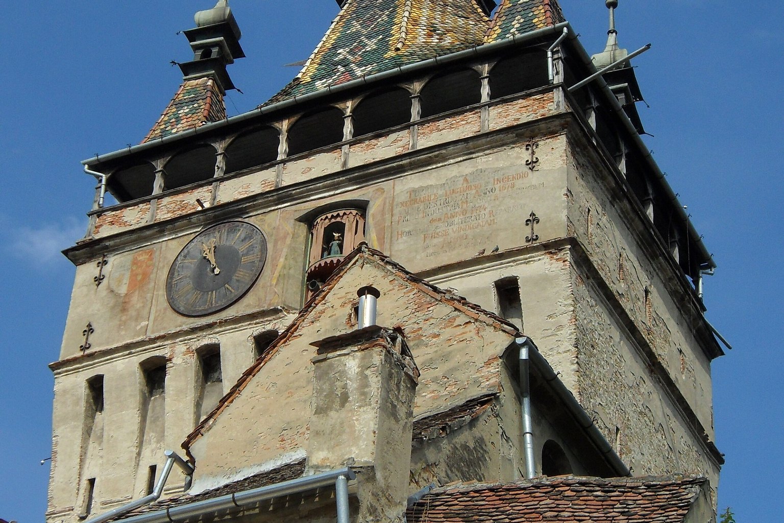 Fortified church tower above village roofs